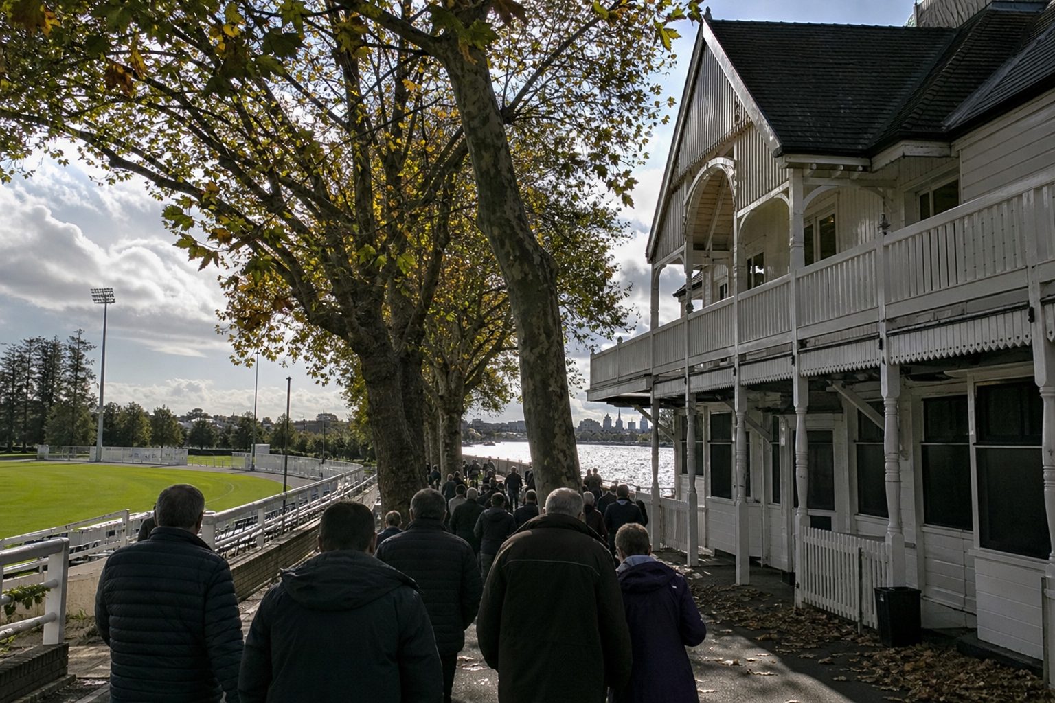 A white Victorian riverside pavilion beside a football ground on the Thames (picture made with AI)
