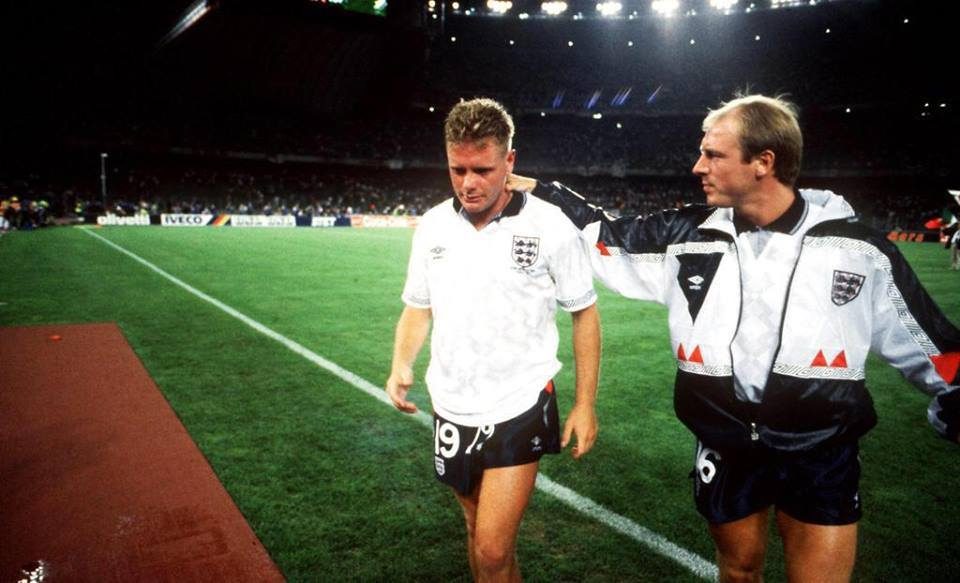 Paul Gascoigne in an England shirt walks off tearful as Steve McMahon puts an arm round him
